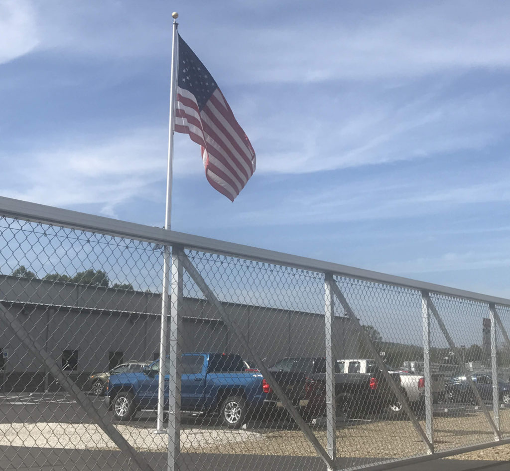 Chain link deals fence flagpole